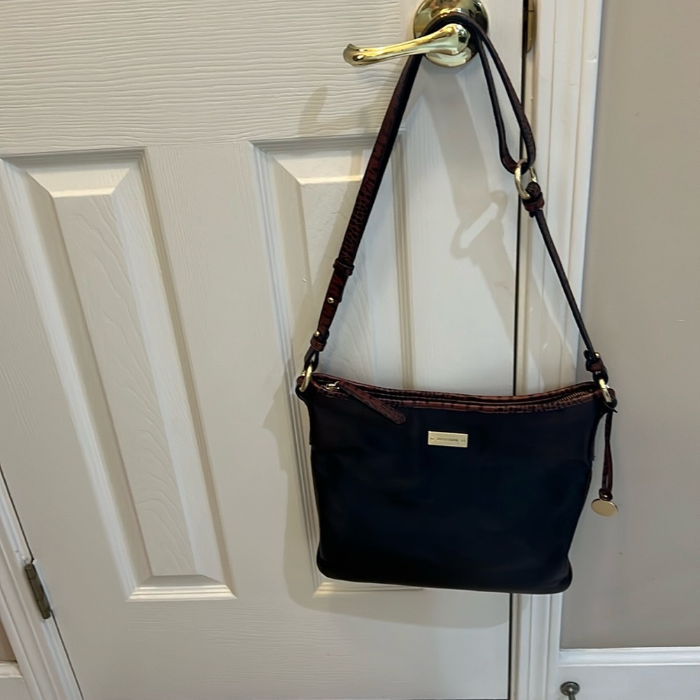 Brahmin black with brown trim shoulder bag.  Matching wallet included.